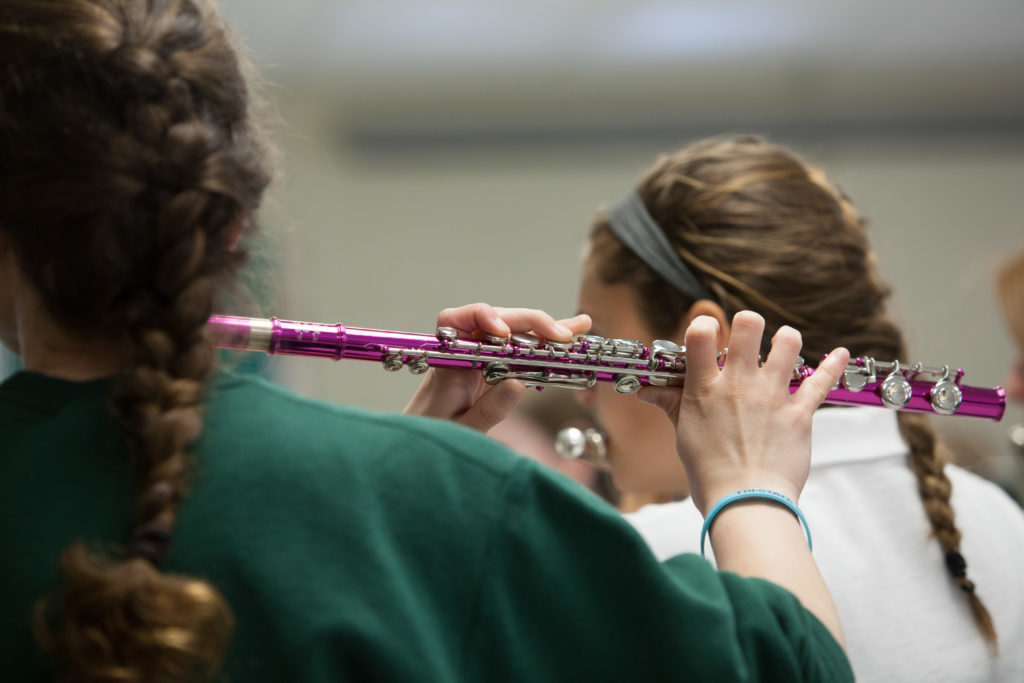 Student playing the flute.